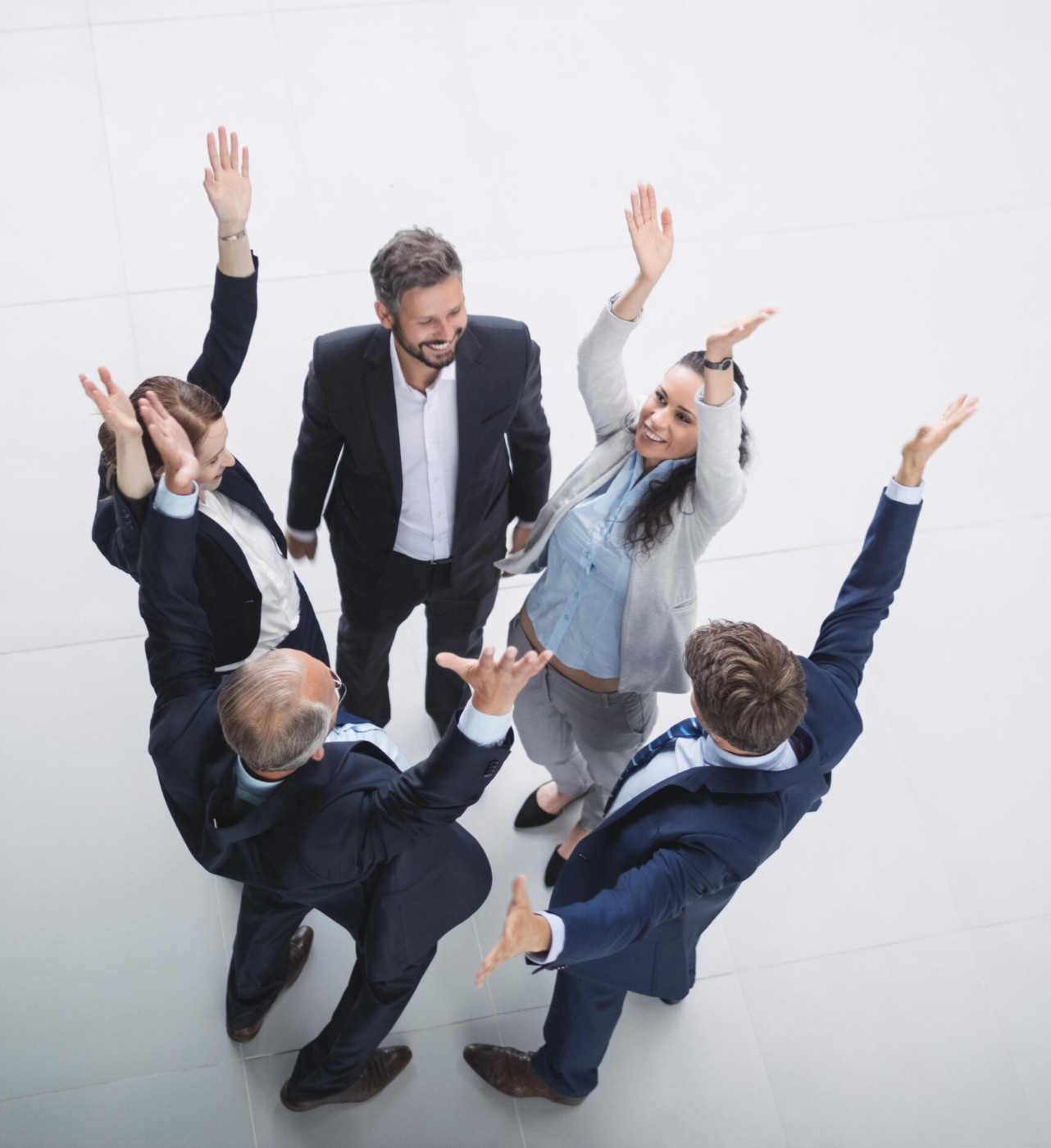 Executives joyfully tossing resumes in the air after a successful executive job search